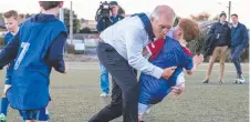  ?? ?? Prime Minister Scott Morrison collides with Luca Fauvette on Wednesday night. Picture: Jason Edwards