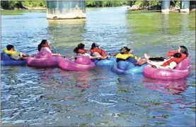  ?? Contribute­d by River Ratz ?? Inner tubers riding River Ratz tubes float near the confluence of the Etowah and Oostanaula rivers.