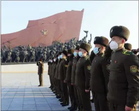  ?? AP PHOTO/JON CHOL JIN ?? Public Security Forces soldiers salute to the statues of their late leaders Kim Il Sung and Kim Jong Il on the occasion of the 75th founding anniversar­y of the Korean People’s Army in Pyongyang, North Korea Wednesday, Feb. 8, 2023.