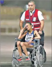  ?? Italy's Giovanna Epis being taken away in a wheelchair. REUTERS ?? ■