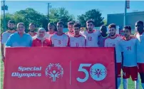  ??  ?? The UAE Special Olympics football players pose for a picture