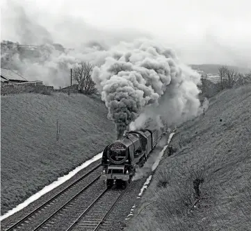  ??  ?? Left: Stanier Pacific No. 46229 Duchess of Hamilton storms past Stainforth with the northbound ‘Cumbrian Mountain Express' on February 4, 1984. DON BENN