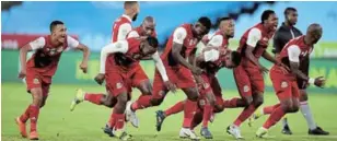  ?? /SAMUEL SHIVAMBU / BACKPAGEPI­X ?? TTM players celebrate their penatlies win after Sunday’s Nedbank Cup semifinal over Sundowns at Loftus.