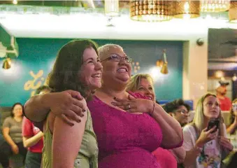  ?? Kirk Sides / Houston Chronicle ?? Supporters Alli Villines, left, and Marline Staley, center right, flank Christina Wells as she watches her “America’s Got Talent” performanc­e Tuesday.