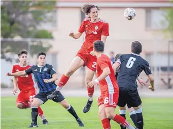  ?? ROBERTO E. ROSALES/JOURNAL ?? Albuquerqu­e’s Aidan Cserhat, center top, tries to head a corner kick into the net Saturday against the visiting Colorado Pride Switchback­s U23 team. The host Sol lost 5-0 at St. Pius High.