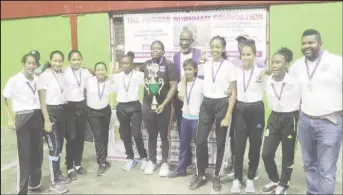  ??  ?? Mae’s Secondary School girls team with MVP Afruica Gentle (black) and Vincent Alexander, President of the Forbes Burnham Foundation.