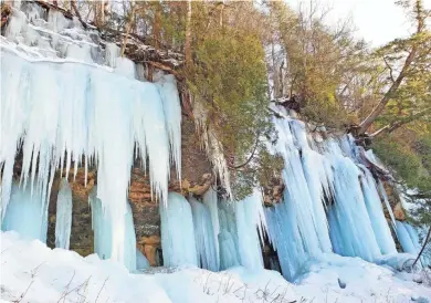  ?? CHELSEY LEWIS/MILWAUKEE JOURNAL SENTINEL ?? The Curtains ice formation in Pictured Rocks National Lakeshore in Michigan’s Upper Peninsula is accessible via a short hike off Sand Point Road.