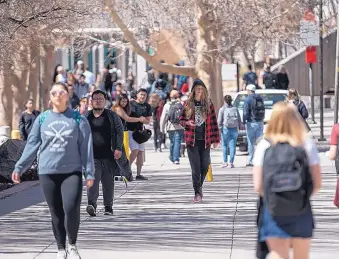  ?? ROBERTO E. ROSALES/JOURNAL ?? Students walk to classes Thursday at UNM. The university’s Board of Regents on Thursday approved a tuition hike proposed by the main campus’s Budget Leadership Team.