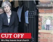  ??  ?? CUT OFF Mrs May leaves local church