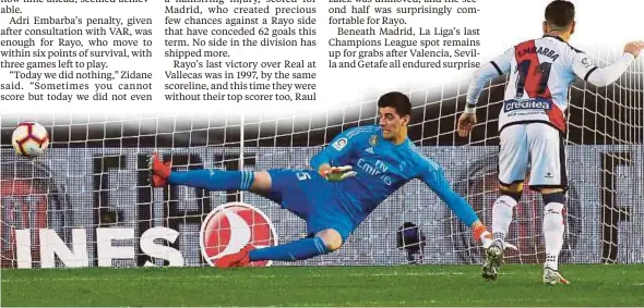  ?? REUTERS PIC ?? Rayo Vallecano’s Adri Embarba scores from the penalty spot against Real Madrid keeper Thibaut Courtois in their La Liga match on Sunday.