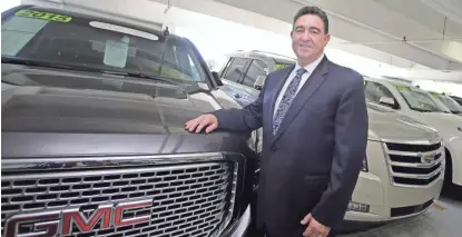  ?? ALAN DIAZ/AP ?? Beny Ledesma, general sales manager at Williamson Buick-Cadillac-GMC in Miami, says leasing accounts for three-quarters of his dealership’s sales, providing a steady stream of low-mileage used cars.