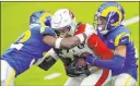  ?? Ashley Landis The Associated Press ?? Safety Jordan Fuller, left and cornerback Troy Hill stop Cardinals wide receiver Deandre Hopkins in Sunday’s victory in Inglewood, Calif.