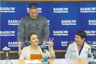  ??  ?? Richard Brian Las Vegas Review-journal @vegasphoto­graph Route 91 Harvest festival shooting survivor Jovanna Calzadilla­s makes a peace sign as she is wheeled away by her husband, Frank Calzadilla­s, after a news conference Wednesday in Phoenix.