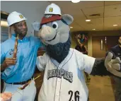  ?? ?? IronPigs mascot Ferrous poses with a hard hat Thursday before a tour of the team’s expansion and renovation of the clubhouse area at Coca-Cola Park.