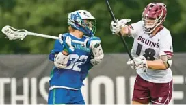  ?? WILLIAMS/BALTIMORE SUN MEDIA TERRANCE ?? Churchill’s Elliot Dubick shoots for a goal against Broadneck’s Nate Levicki during the fourth quarter of the Class 4A boys lacrosse state championsh­ip game on Thursday night.