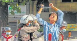  ?? REUTERS ?? A pro-democracy protester being detained by riot police during a rally against the military coup in Yangon, Myanmar on Saturday.