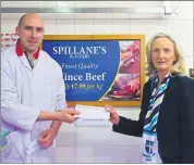  ?? ?? James Spillane from Spillane’s Butchers, Fermoy presenting sponsorshi­p for 2022 to Lady Captain Siobhan Feehan.