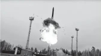  ?? Russian Defense Ministry Press Service / Associated Press ?? An interconti­nental ballistic missile lifts off from a truck-mounted launcher somewhere in Russia. The Russian military said its Avangard hypersonic weapon entered combat duty Friday.