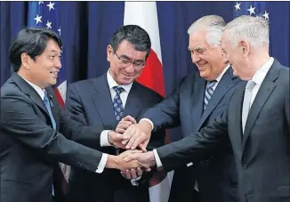  ?? [JACQUELYN MARTIN/THE ASSOCIATED PRESS] ?? From left, Japanese Defense Minister Itsunori Onodera, Japanese Foreign Minister Taro Kono, Secretary of State Rex Tillerson and Defense Secretary Jim Mattis gather for a ceremonial handshake before security talks Thursday at the State Department....