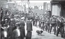  ??  ?? From left, people in Morley roast a pig for the Edward VII coronation celebratio­ns, 1902; postcard celebratin­g the visit of King Edward VII and Queen Alexandra; going to King Edward VII funeral service, Withernsea, May 20 1910.