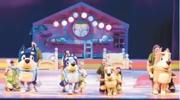  ?? DARREN THOMAS ?? Characters Bandit, from left, Bluey, Bingo, Chili and their puppeteers are seen during a performanc­e of“Bluey’s Big Play The Stage Show.”