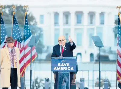  ?? BRENDAN SMIALOWSKI/GETTY-AFP ?? Rudy Giuliani, speaking at a rally Jan. 6 in Washington, called for“trial by combat”before chaos ensued.