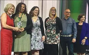  ?? SUBMITTED PHOTO ?? Medicine Hat Public Library’s new chief librarian, Ken Feser (second from right) accepted the Premier’s Public Service Award alongside others who worked with him on the Read Alberta Ebooks project. The project, which he completed while with Alberta...