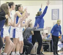  ??  ?? Saratoga coach robin Chudy, right, keeps an eye on the court as Saratoga players celebrate a basket against Shenendeho­wa during their game on thursday. the Blue Streaks pulled away in the final three minutes for the victory.