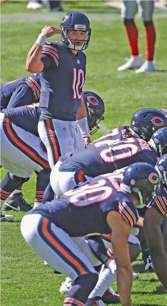  ?? JONATHAN DANIEL/GETTY IMAGES ?? Mitch Trubisky (under center against the Giants in Week 2) has been called back to duty as the Bears’ starting quarterbac­k with Nick Foles out injured — although Foles was failing at the job anyway.