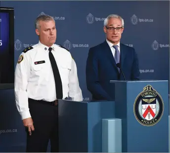  ?? CP PHOTO ?? Toronto Police Inspector Bryan Bott, left, and Chief Coroner for Ontario Dr. Dirk Huyer, speak at a news conference in yesterday on the identities of the victims of the Yonge Street van attack and the current state of the investigat­ion.