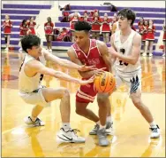  ?? TIMES photograph by Annette Beard ?? Blackhawk senior Hunter Rains works his way through Dardenelle defenders Wednesday. Rains was the high scorer with 11 points.