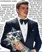  ?? REX ?? Champion: Verstappen with his trophy