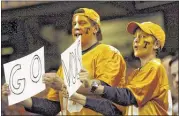  ?? PAUL EFIRD/KNOXVILLE NEWS SENTINEL FILES ?? Tennessee fan Marty Bostrom and his son, Joshua, 11, from Knoxville fire up the Volunteers.