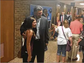  ?? JEREMY P. KELLEY / STAFF ?? Pro Football Hall of Famer Anthony Munoz poses for pictures with Xenia teachers and staff after giving a motivation­al speech at Xenia High School on Thursday. Munoz runs a youth foundation and emphasized teacher-student mentorship.