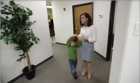  ?? ERIC GAY - THE ASSOCIATED PRESS ?? Bethany Babcock, co-owner of Foresite Commercial Real Estate, right, stands with her son, Ethan, at her office in San Antonio on Tuesday. For many small business owners, being a boss means helping staffers when they struggle Babcock, who runs a familyfrie­ndly business, has bought a plane ticket for a staffer who needed to visit a relative on life support and paid moving expenses for a staffer who was having family problems, as well as permitting staff to bring their children to work.