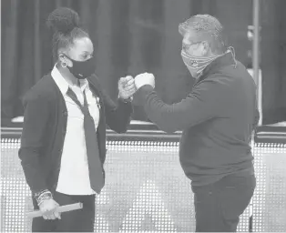  ?? DAVID BUTLER II/AP ?? UConn head coach Geno Auriemma greets South Carolina head coach Dawn Staley before a Feb. 8 game in Storrs.