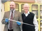  ??  ?? Phillip Mead, left, and B. Owen Williams with the Pettibone sword Williams donated to the Museum of the American Revolution.