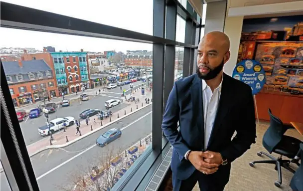  ?? PAT GREENHOUSE/GLOBE STAFF ?? Greg Wilmot, the president and chief executive of East Boston Neighborho­od Health Center, looked at Maverick Square from his office.