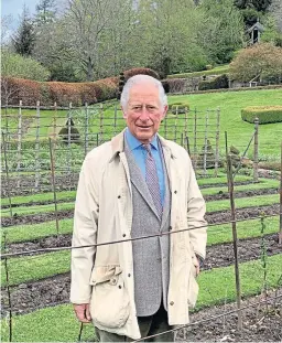  ?? Picture: PA. ?? Down-to-earth stuff for Prince Charles, the Duke of Rothesay, as he calls on people to get out there and pick the fruit harvest.