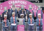  ?? AP ?? US players celebrate winning the Fed Cup.