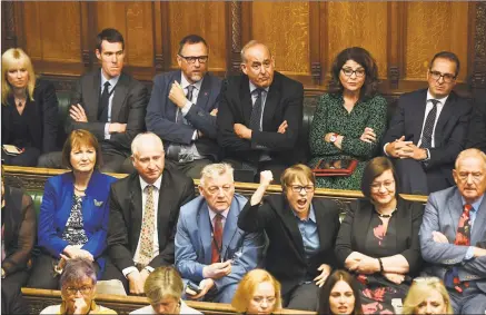  ?? Jessica Taylor / House of Commons via AP ?? In this handout photo provided by the House of Commons, opposition MP’s look on as Britain’s General Attorney Geoffrey Cox speaks in Parliament in London on Wednesday. British lawmakers returned to the House of Commons on Wednesday, venting their pentup anger over Prime Minister Boris Johnson’s failed attempt to suspend Parliament and warning that democracy itself is under threat from the government.