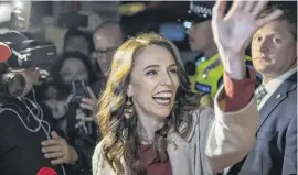  ?? PHOTO: THE NEW ZEALAND HERALD ?? Big win . . . Prime Minister Jacinda Ardern waves to neighbours and media outside her house in Sandringha­m, Auckland, on election night.