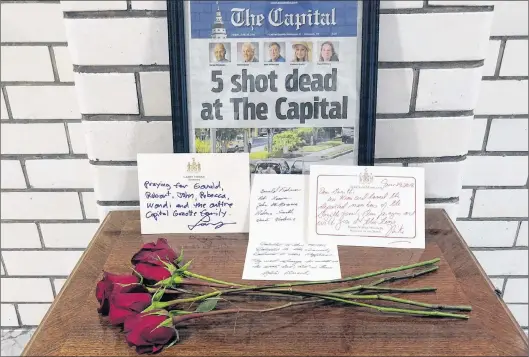  ?? BRIAN WITTE/THE ASSOCIATED PRESS ?? Letters and flowers form a memorial at the State House in Annapolis, Md., June 29, in honour of the five slain members of The Capital Gazette newspaper who were shot and killed in a newsroom attack the day before. Online harassment from members of the...