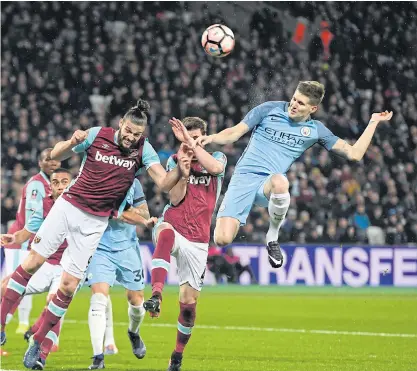  ??  ?? Manchester City’s John Stones, right, in action against West Ham.