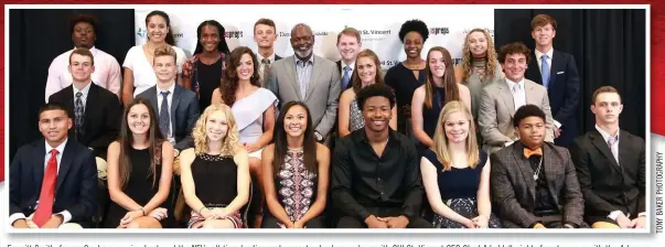  ??  ?? Emmitt Smith, former Cowboys running back and the NFL’s all-time leading rusher, center, back row, along with CHI St. Vincent CEO Chad Aduddell, right of center, pose with the Arkansas Democrat-Gazette’s All-Arkansas Preps award winners. The honorees...