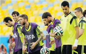  ?? MANU FERNANDEZ/The Associated Press ?? Spain’s players attend a training session at the Maracana stadium in Rio de JaneiroTue­sday. Spain faces Chile in a critical Group B match on Wednesday.