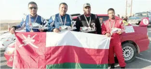  ?? – Supplied photo ?? FEELING PROUD: Oman’s Hamid Al Qasimi, second left, and Faisal Al Rashdi, second right, pose along with their co-drivers after the Um Al Quwain Rally in UAE.