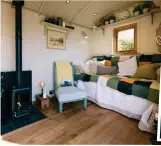  ??  ?? The home office: The huts have a wood-burner ood-burner and pine panelling