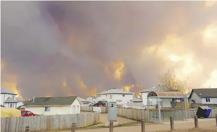  ?? MARY SEXSMITH/THE CANADIAN PRESS ?? The view in Fort McMurray on May 3, 2016, as the wildfire approached.