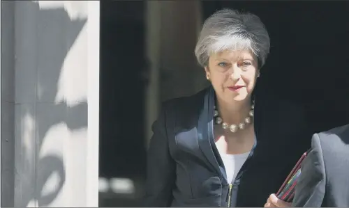  ?? PICTURE: PA. ?? Prime Minister Theresa May leaves 10 Downing Street yesterday ahead of Prime Minister’s Questions. STANDING FIRM: